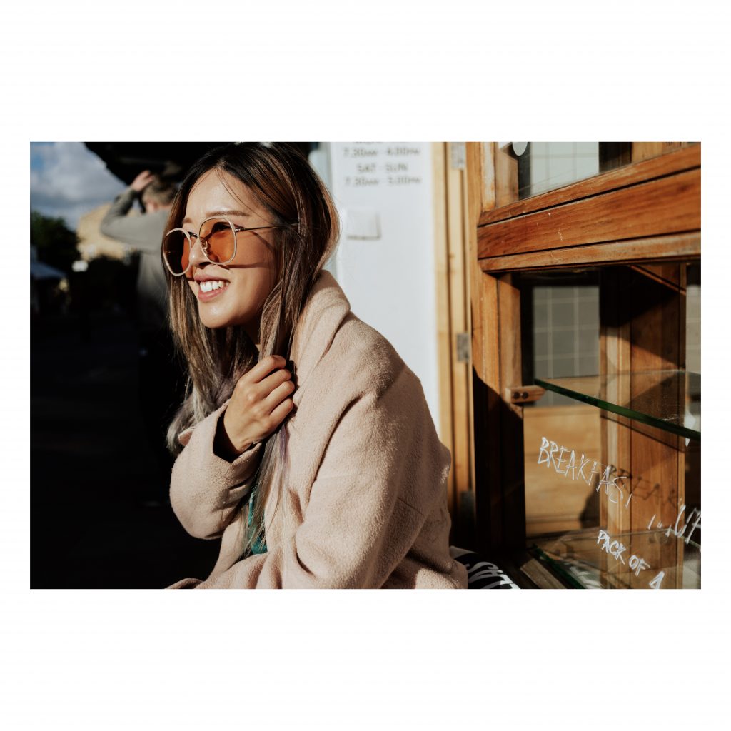 girl with sunglasses smiling