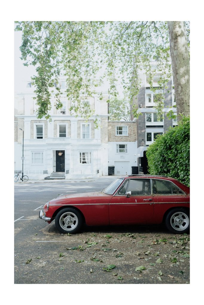 red car in London in summer 2023